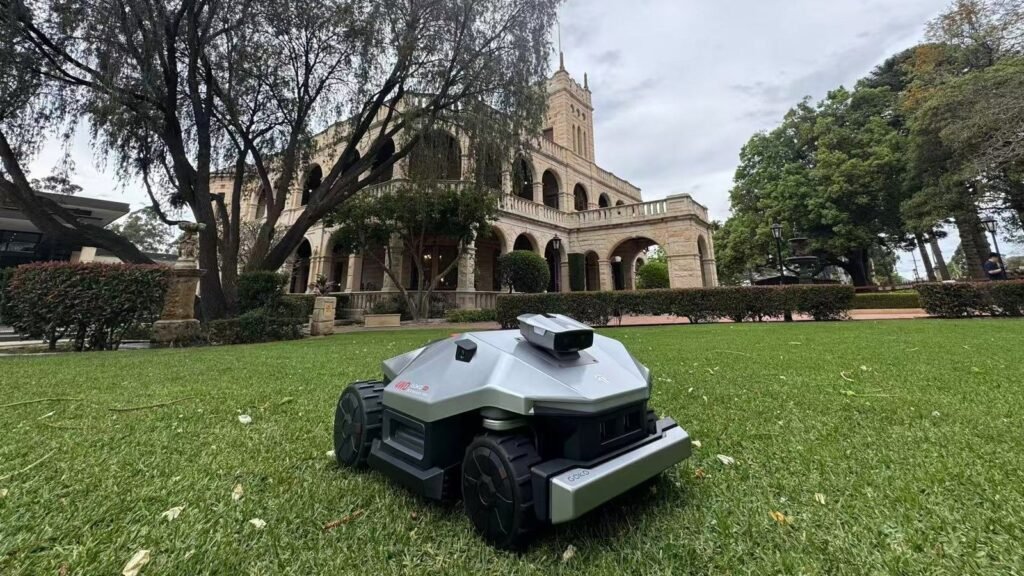 GOKO M6 robot mower on the lawn in front of Curzon Hall, Sydney