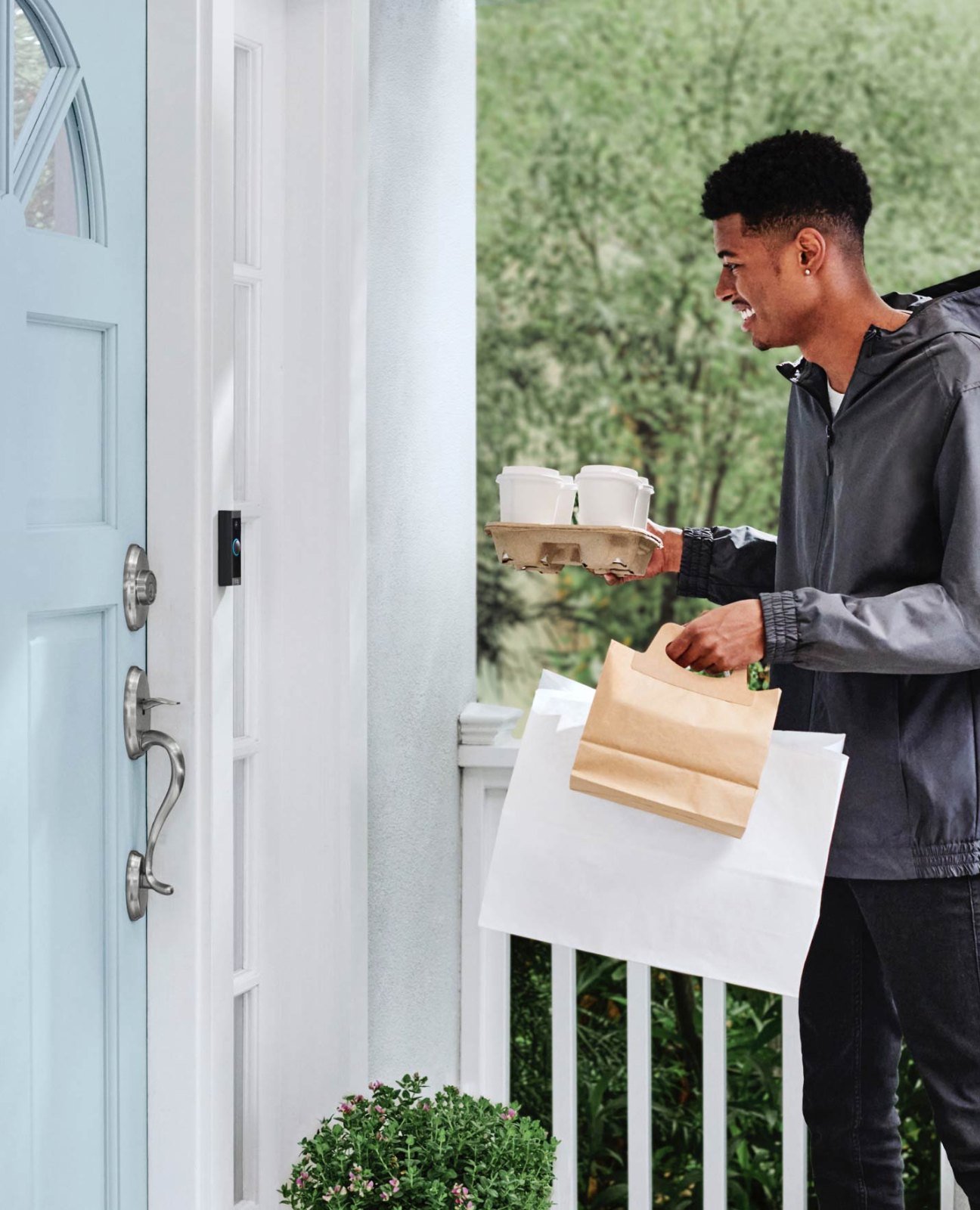 Visitor at a door with Ring Video Doorbell Wired